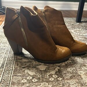 Burnt orange/brown boots with a 3 inch heel.